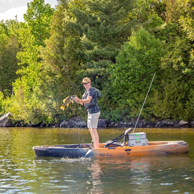 Standing up fishing in Old Town Sportsman 120 fishing kayak