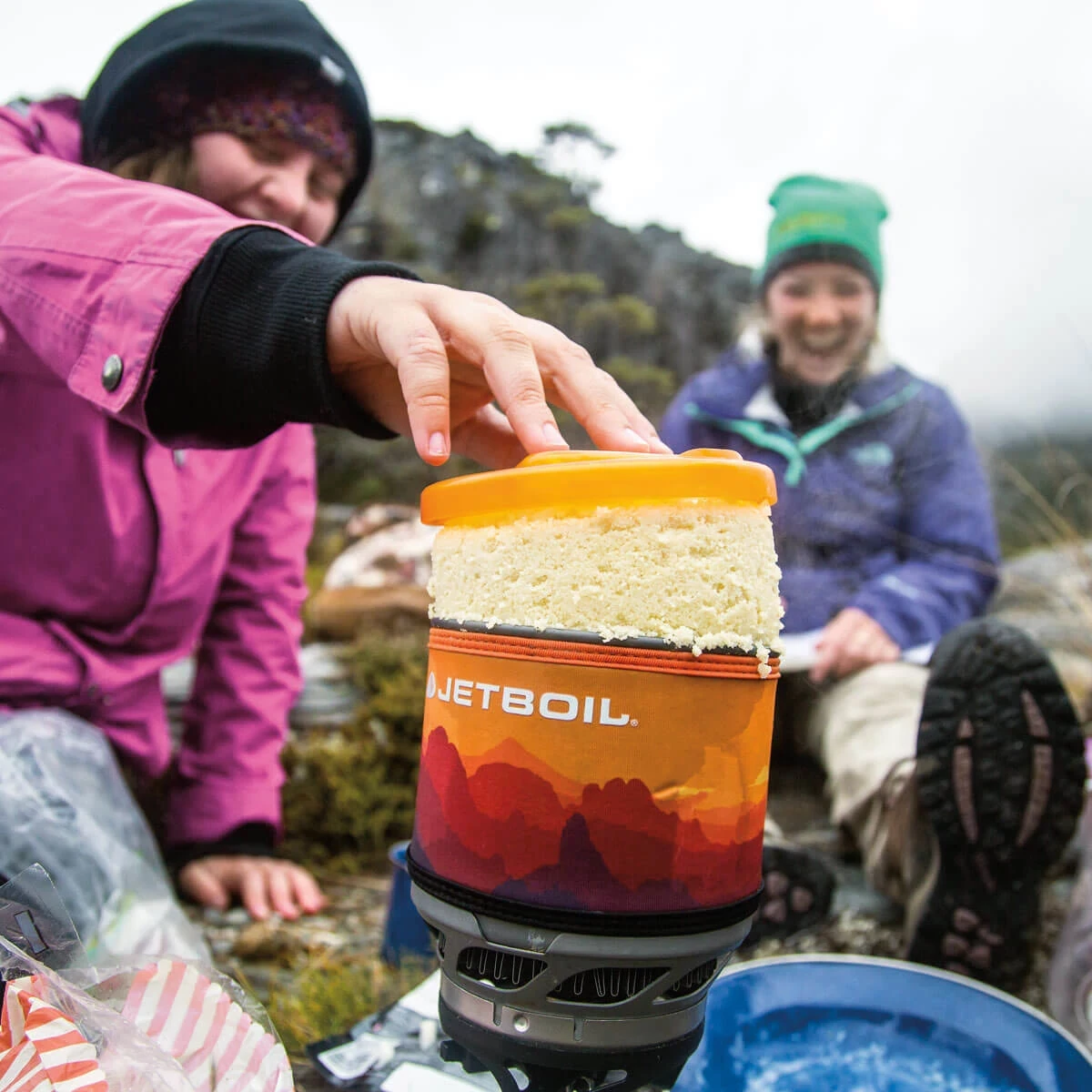 Pulling out cooked couscous from a Jetboil MiniMo cooking system