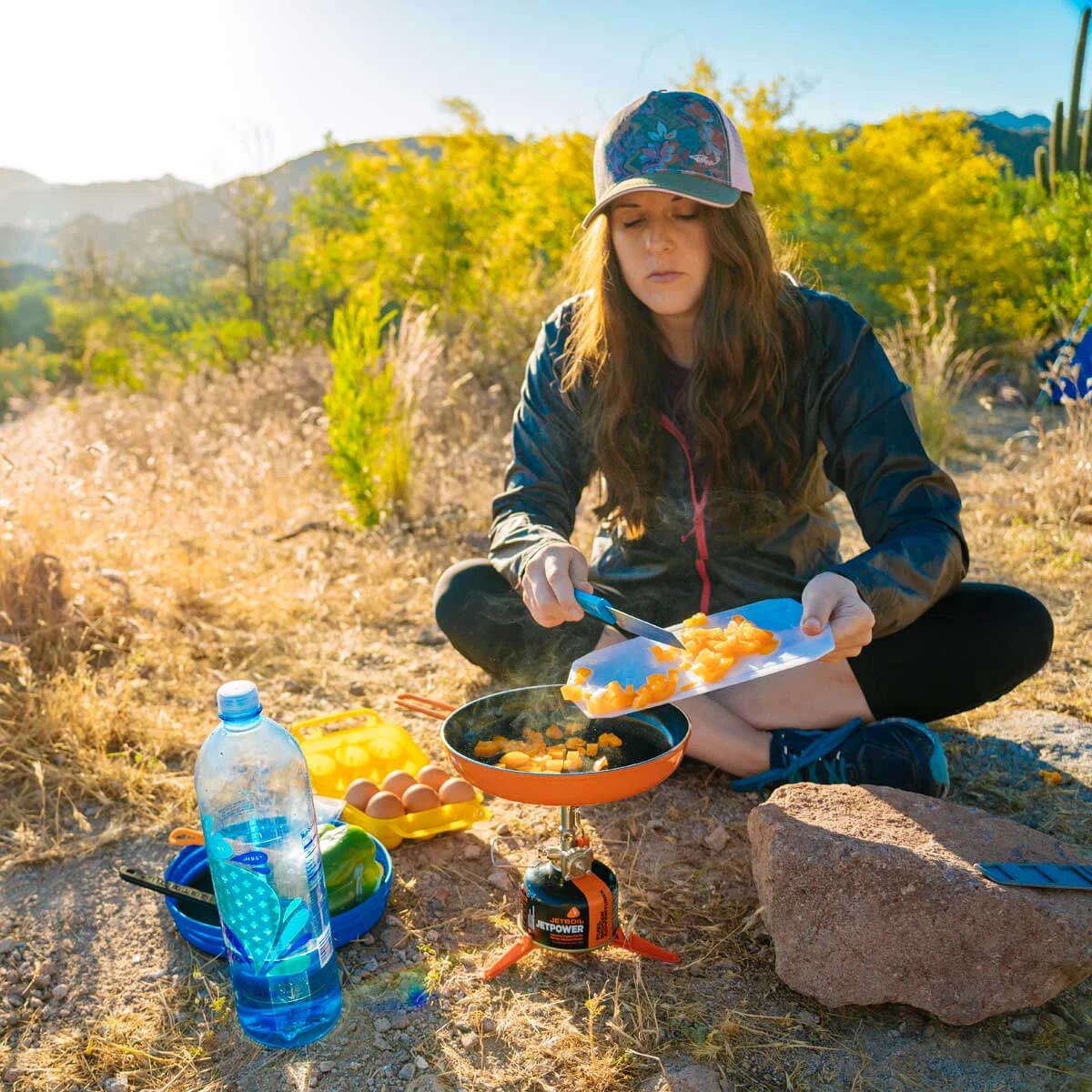 Hiker cooking with the Summit Skillet on the MightyMo