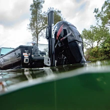 Fully extended black Talon mounted on boat's transom