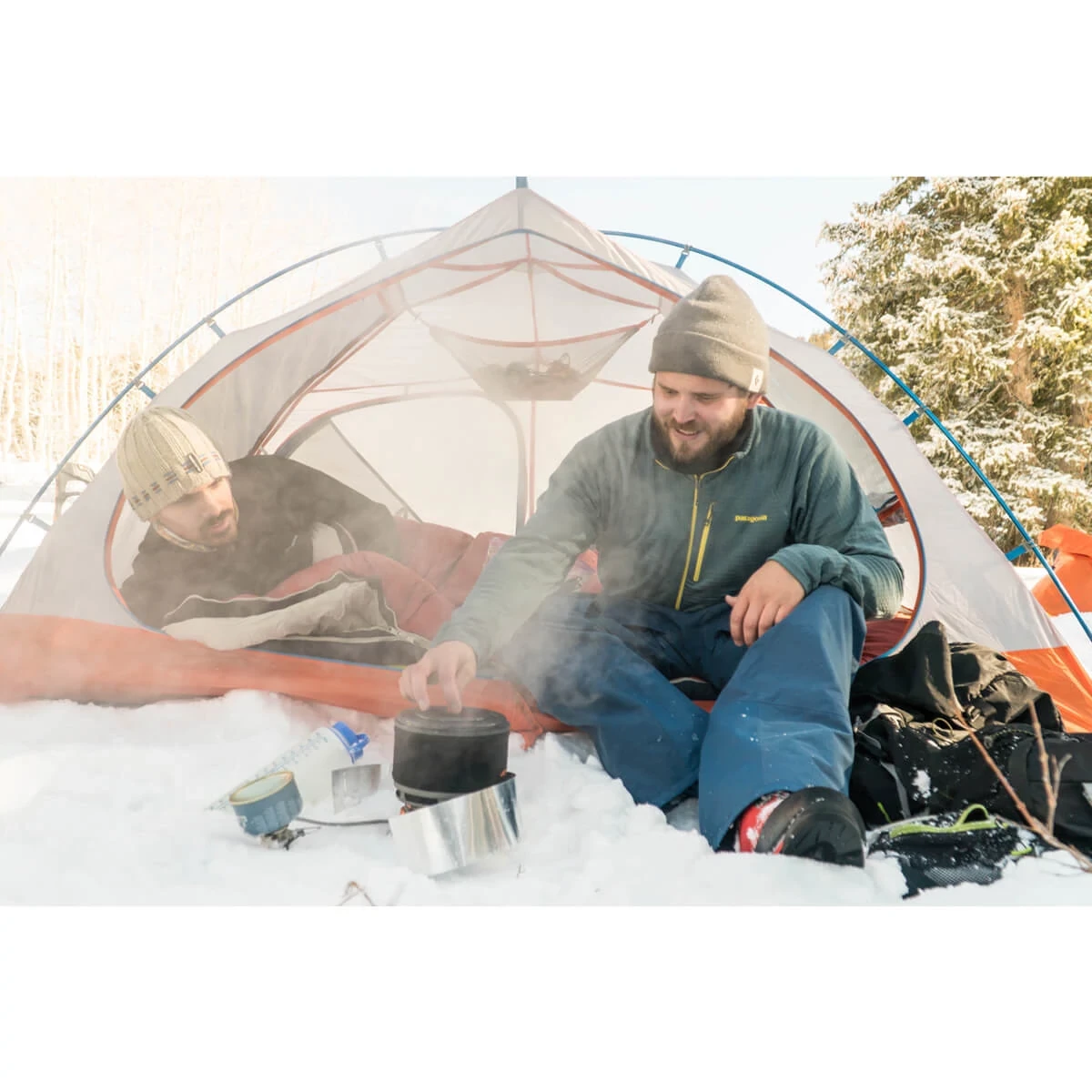 Two friends camp cooking outside the Mountain Pass 2 person tent