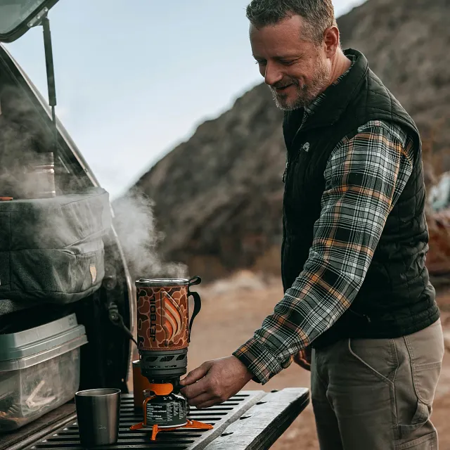 Steam rolling out of cook pot in the Jetboil Flash 1.0L Fast Boil System in Duck Camo fully