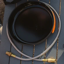 Jetboil JetLink hose wrapped around 10 inch fry pan