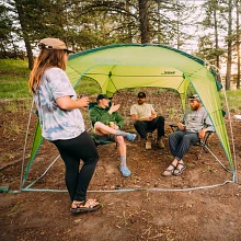 Group of friends enjoying beverages underneath Eureka! Tagalong Shelter