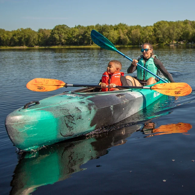 Paddlers in the Old Town Twin Heron kayak