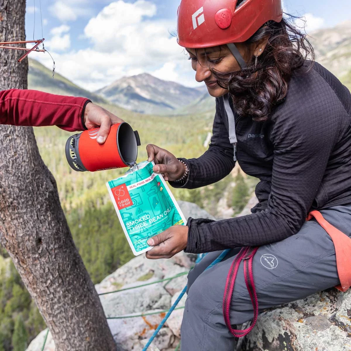 Climbers adding hot water to a Good To-Go meal