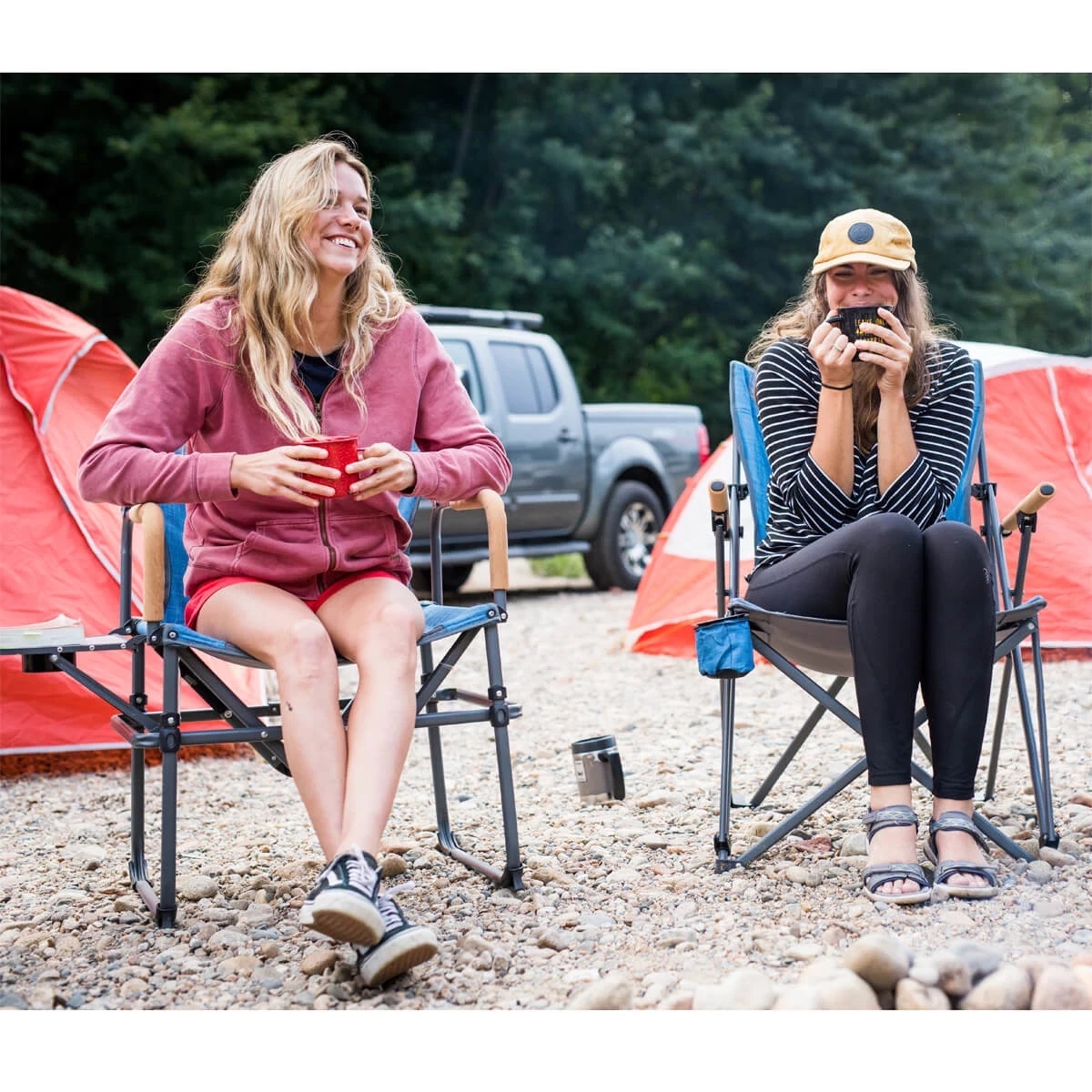 Two women sitting in Eureka! camp chairs