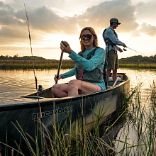 One paddler and fisher in the Old Town Discovery Sport 15 canoe