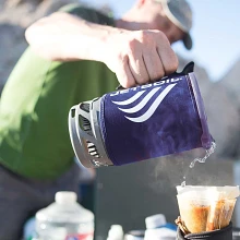 Pouring hot water from a Flash Cooking System.