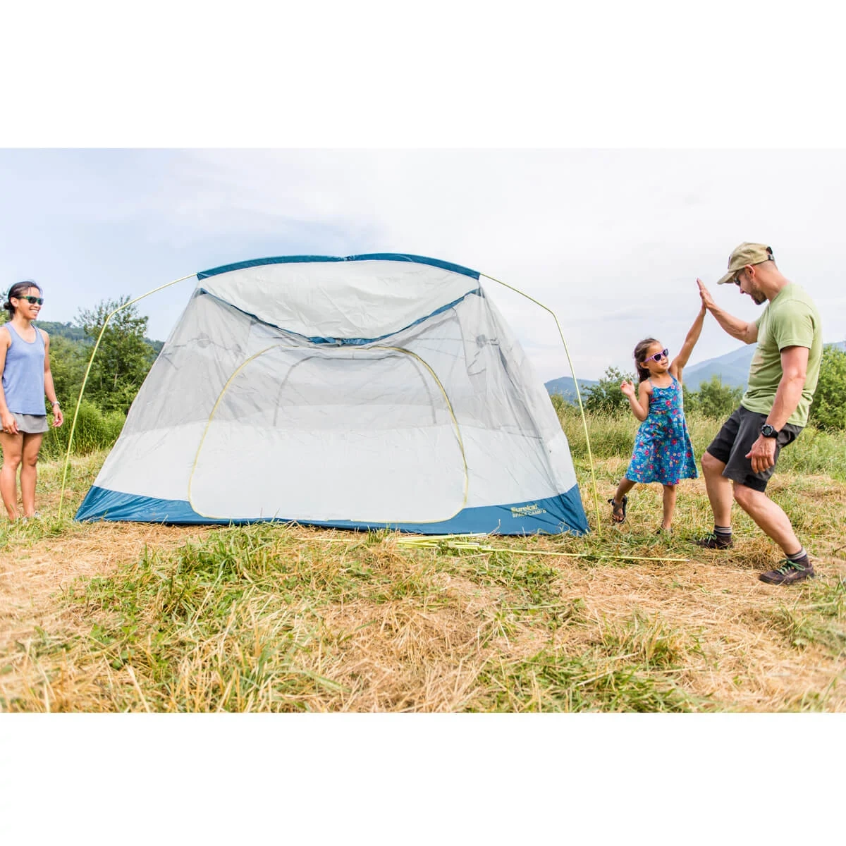 Family setting up Space Camp tent