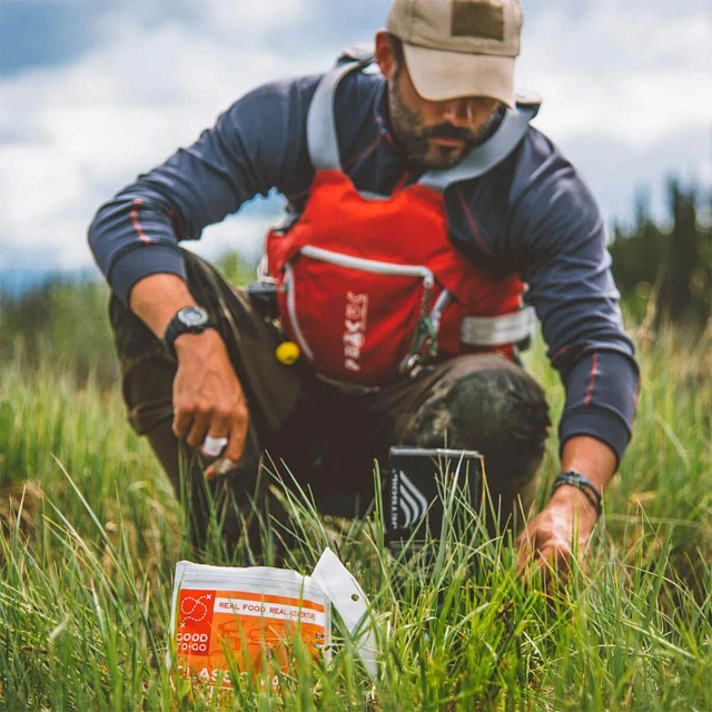 Man in field with Jetboil stove and Good To-Go meal