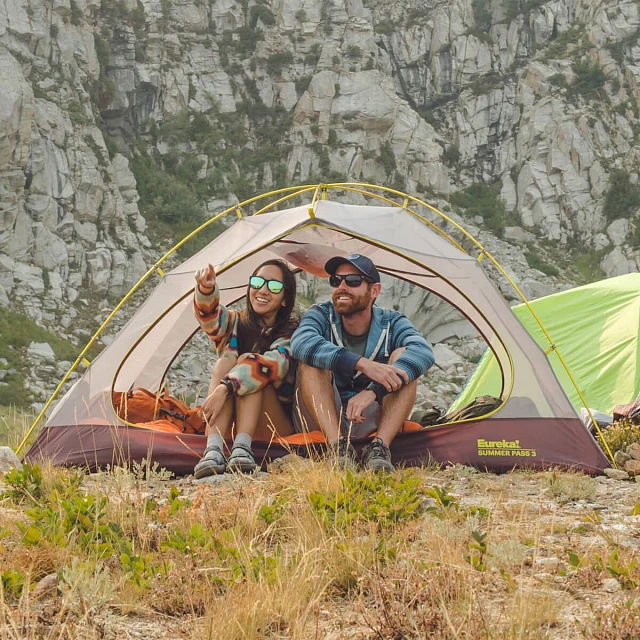 Couple sitting in Summer Pass tent