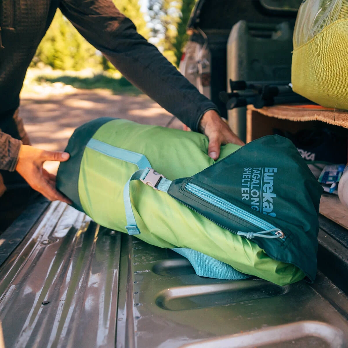 Grabbing the Eureka! Tagalong Shelter from a truck bed