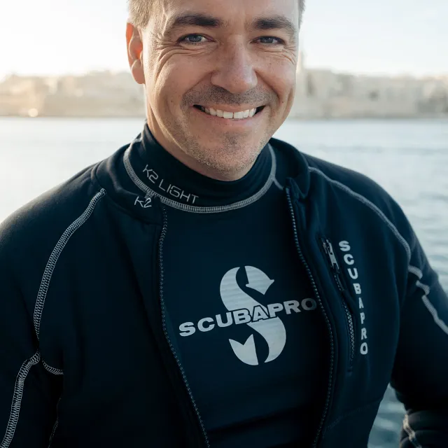 K2 Midweight Top Undergarment, Men - Donned on Scuba Diver