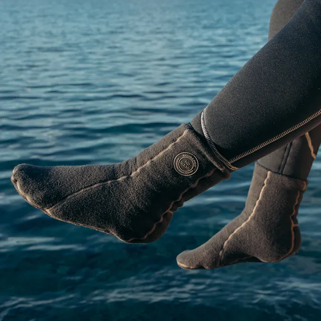 K2 Dive Sock - Dangling Feet Off Pier Over Water