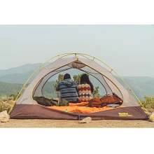 Couple sitting in Summer Pass tent enjoying the view