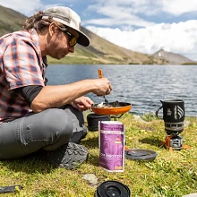 Man cooking with the  Herbed Mushroom Risotto Good To-Go meal