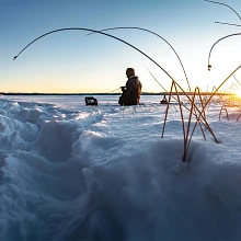 Angler ice fishing using Humminbird ICE HELIX