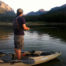 Man standing up fishing in Predator MX Angler