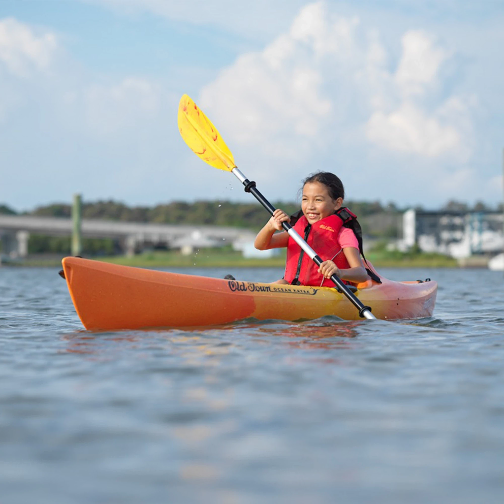 Child paddling in Ocean Kayak Banzai Kayak