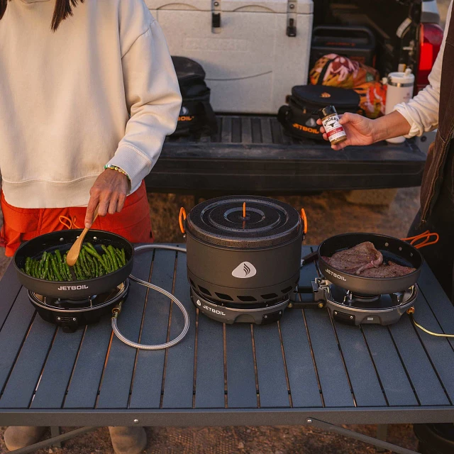 Genesis 3 Stove Bundle set up on camp table