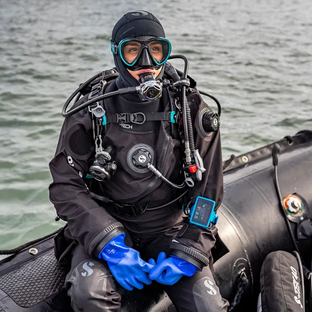 Blue Dry Glove - Diver sitting on boat