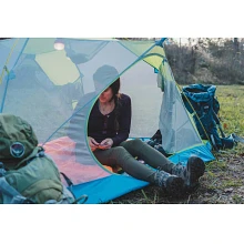 Women sitting inside Midori tent