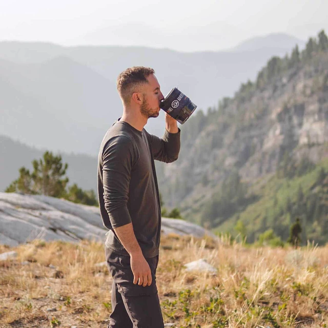 Man enjoying a hot beverage in MiniMo Cooking system