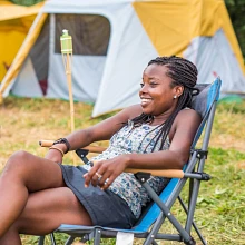 Woman sitting in Eureka! Camp Chair