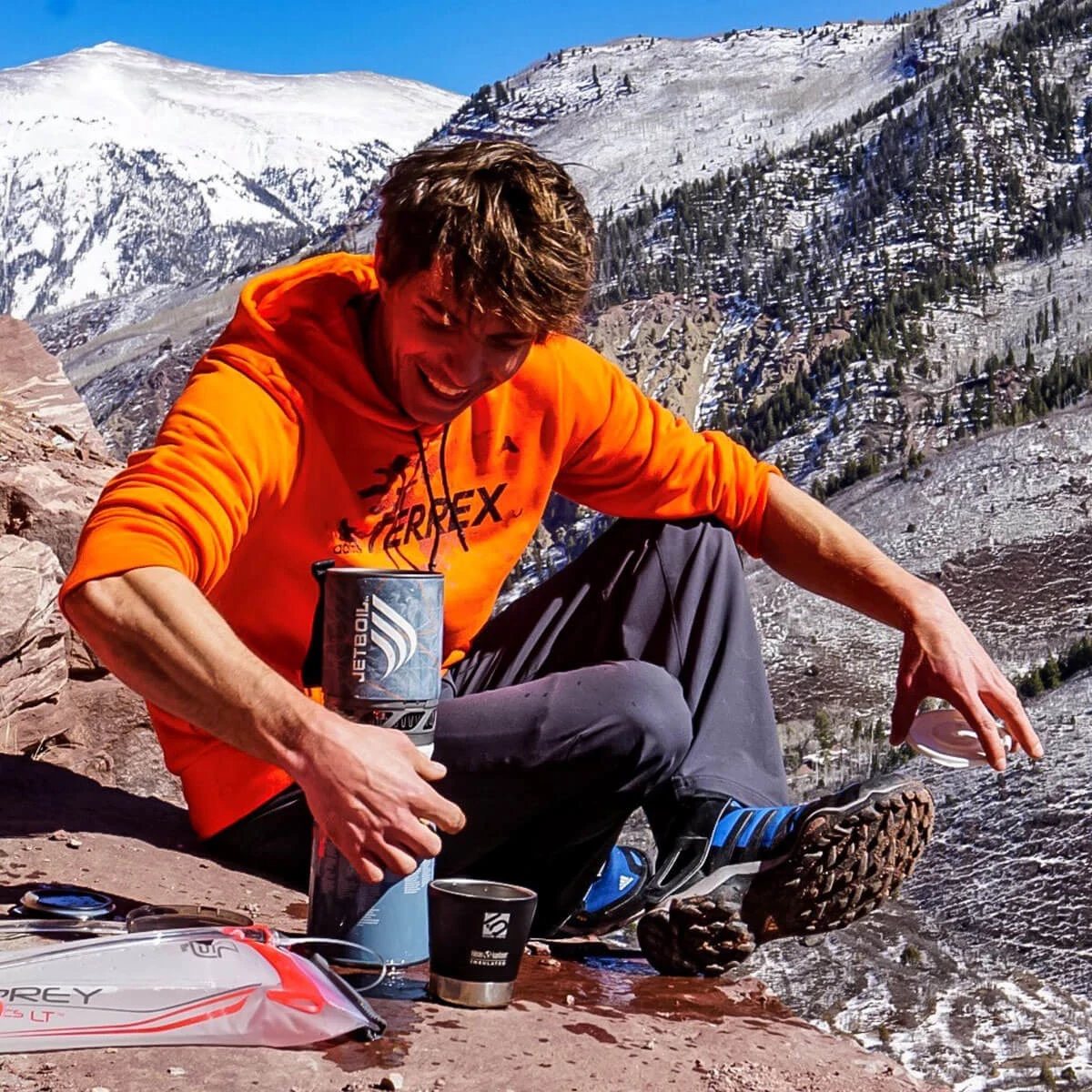 Cooking on a rock ledge in the mountains with the Storm MicroMo Cooking System
