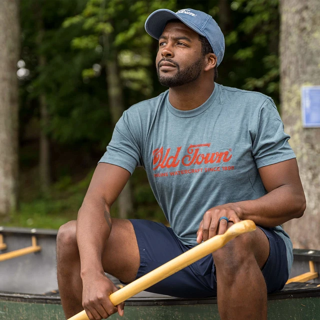 Man wearing Old Town Genuine Watercraft T-shirt