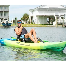 Smiling man pedaling in Old Town Ocean Kayak Malibu Pedal Kayak