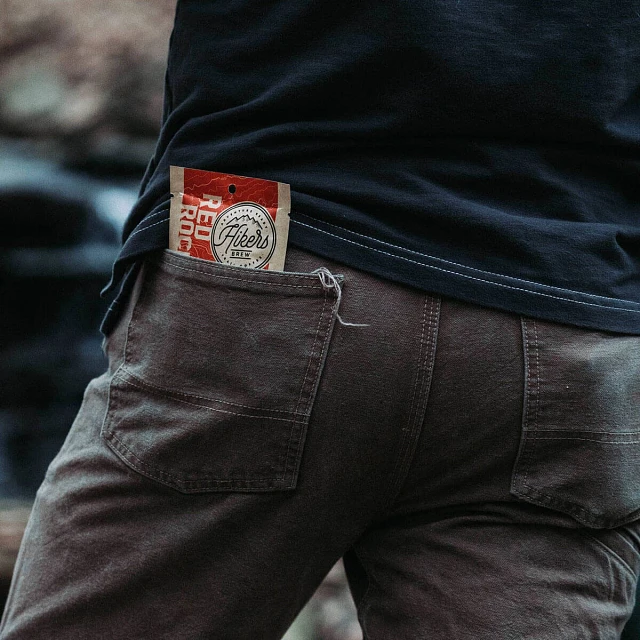 Red Rocks Mile Marker Coffee packet in back pocket of jeans