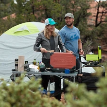 Couple cooking on the Spire Camp Stoves