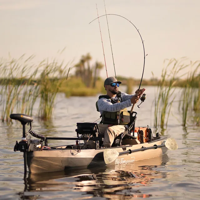 Fishing on a lake in the Old Town Sportsman 120 Pro fishing kayak