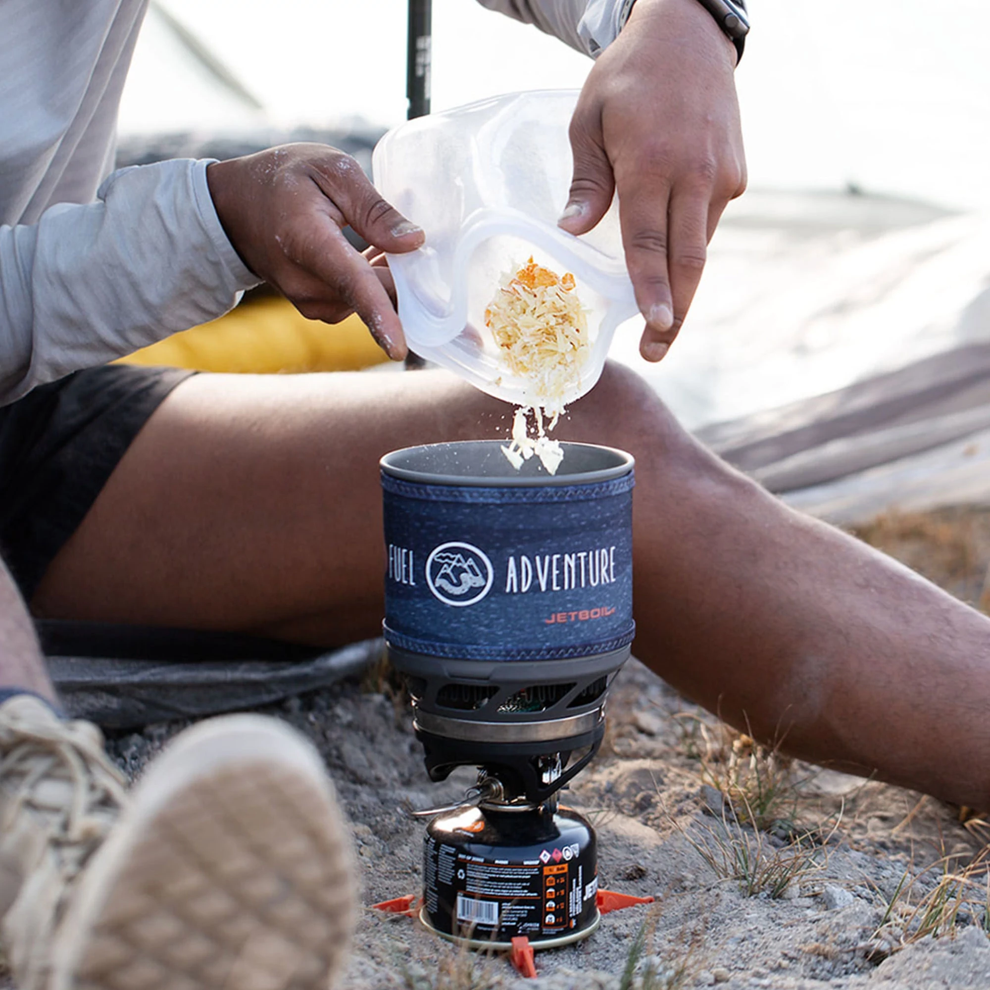 Pouring food from Stasher Sandwich Bag into Jetboil MiniMo Cooking System