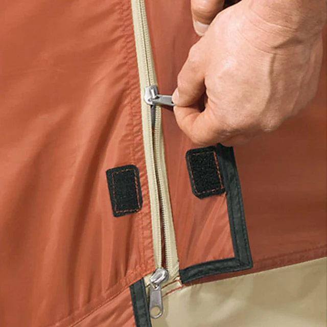 Fabric cover protects zipper opening on door