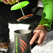 Silicone coffee press being inserted into a Flash cook pot