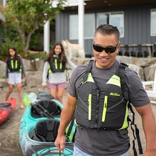 Wearing the Old Town Riverstream Universal Life Jacket in Black Neon