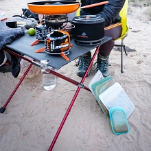 4 Stasher Sandwich Bags next to portable cooking camp table with various Jetboil Cooking Systems