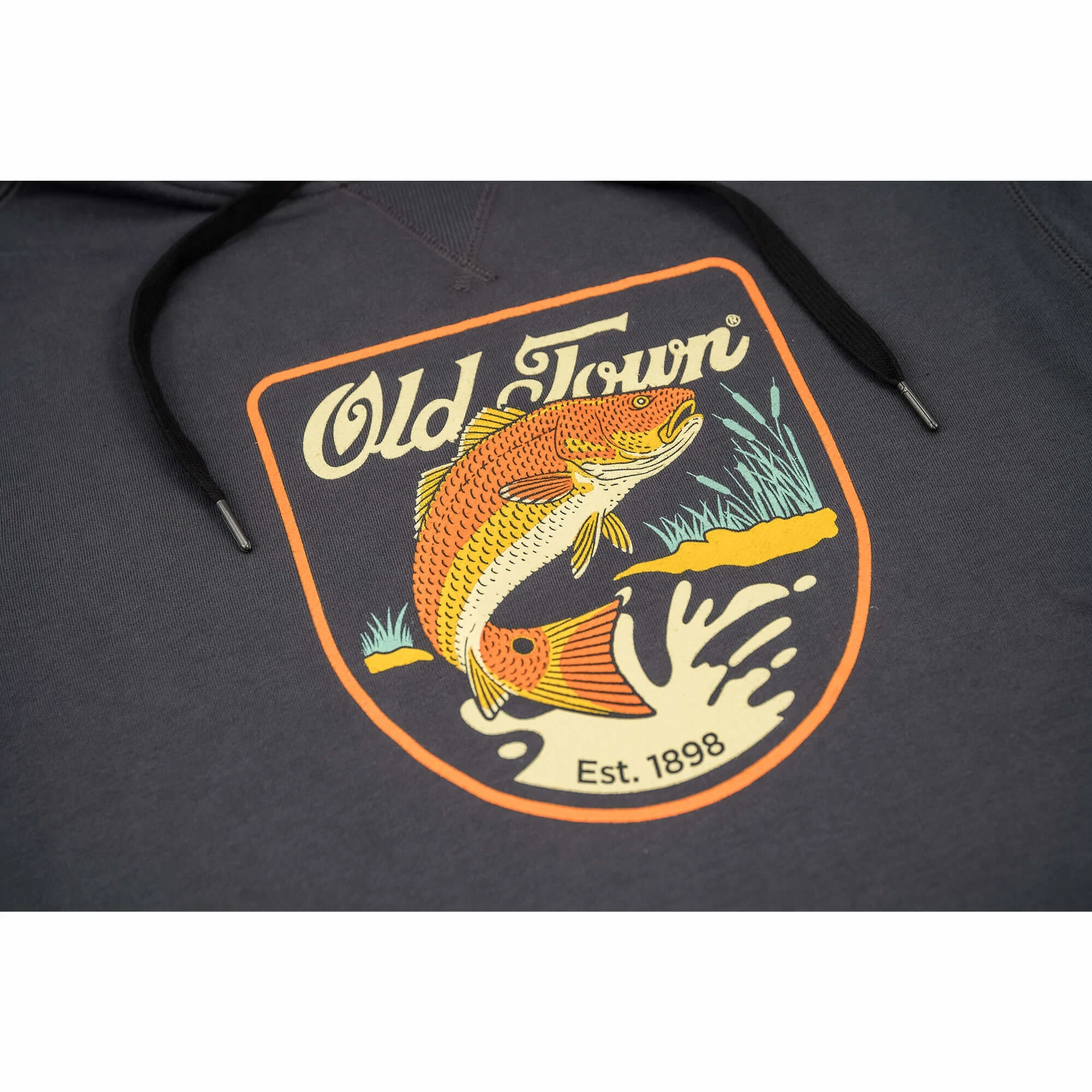 Closeup of Bass Emblem on Men's French Terry Pullover Hoodie - Redfish in Graphite