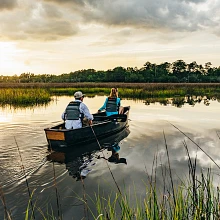 Two paddlers in the Old Town Discovery Sport 15 canoe